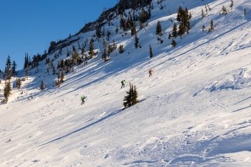 Three hikers going up the Needle Peak