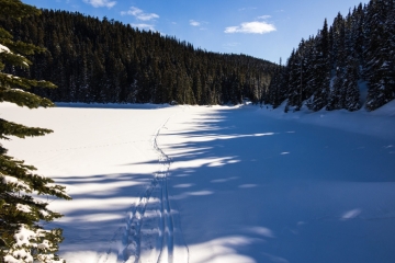 Barrier lake covered with thick snow you can even cross it