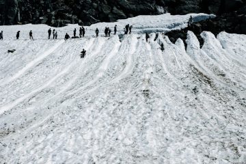 People sliding down a slope