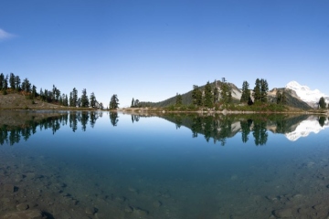 The big Elfin Lake with reflection of nearby mountains