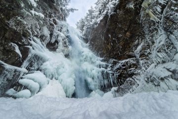 Half frozen Norvan Falls, North Vancouver, British Columbia